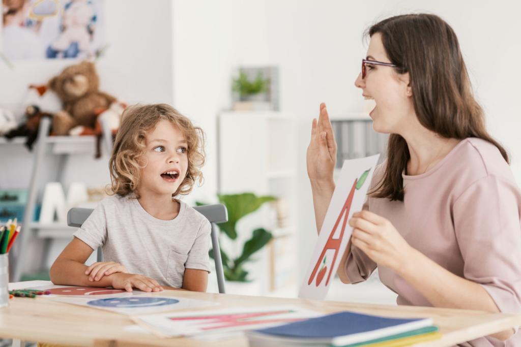 speech language therapist working with student